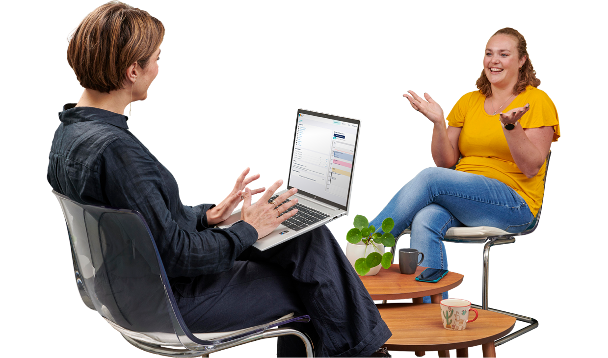 Mental health therapist talking to client with laptop on lap showing EPD software