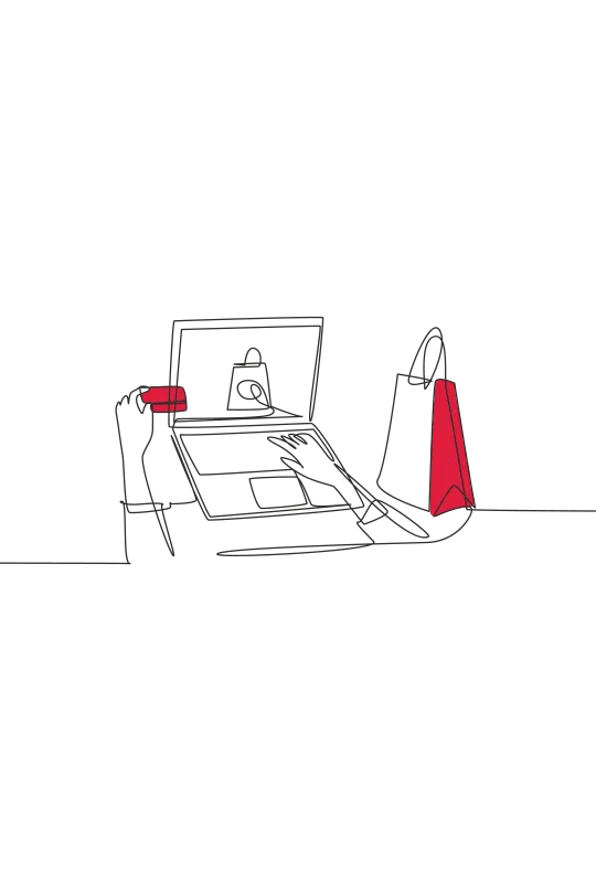 An illustration of someone using their laptop with a bank card in their left hand with a shopping bag next to them
