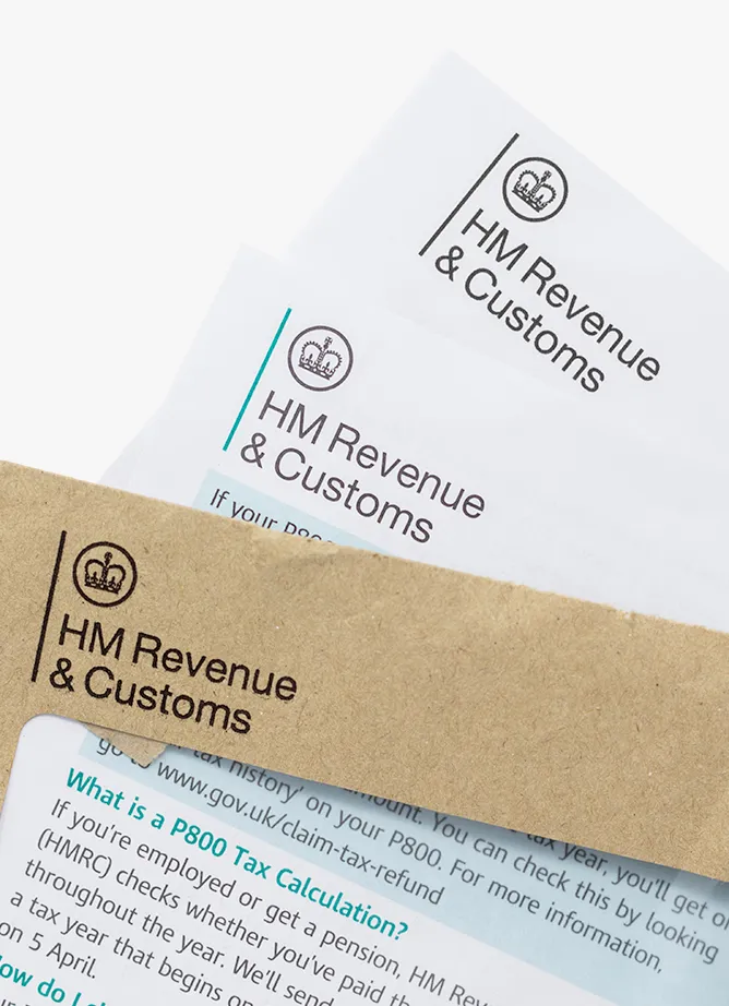A photo showing an envelope from HMRC with two pieces of HMRC letterheaded paper sticking out of the top